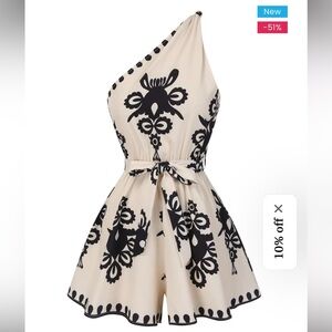 Chic Cream and Black A-Line Romper with Floral Patterns